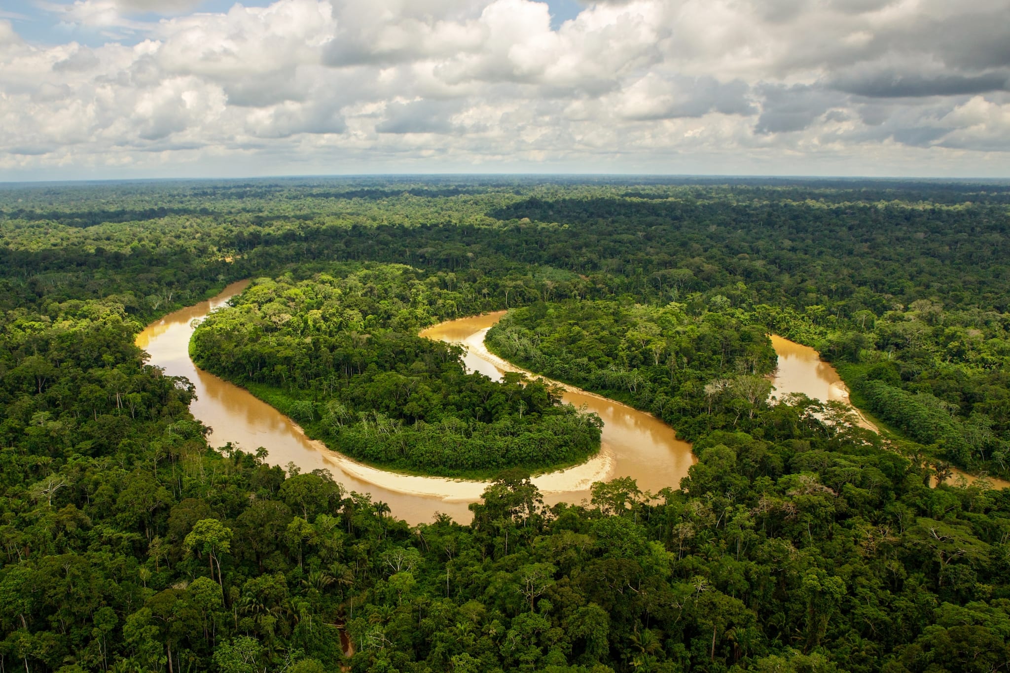 An image of the amazon river winding within the forest. Full credit to CEDIA