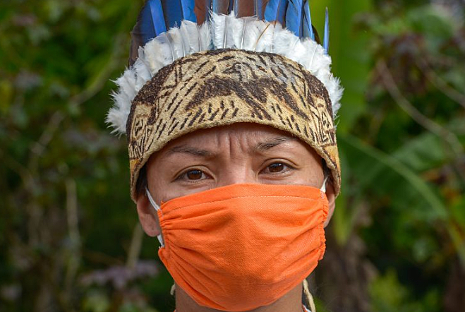 Indigenous Amazon native wearing a face mask