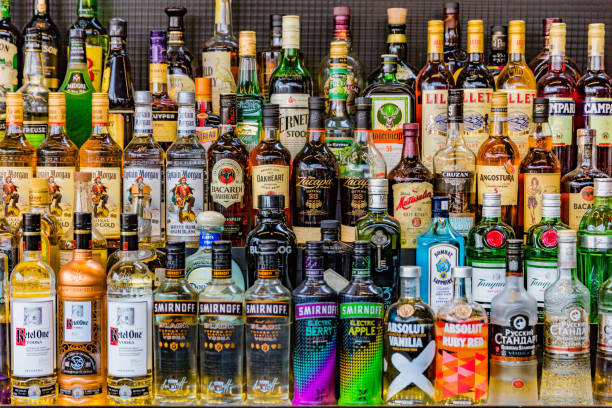 Vodkas Rhum Gin Alcohol liquors drinks bottles on a bar stand