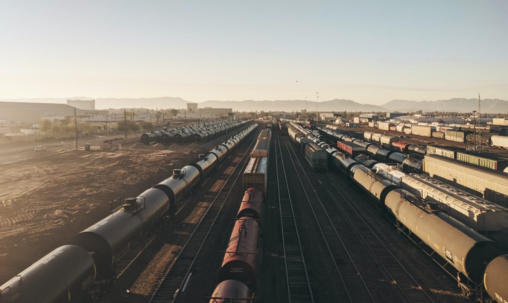 global trade trains in a remote wasteland