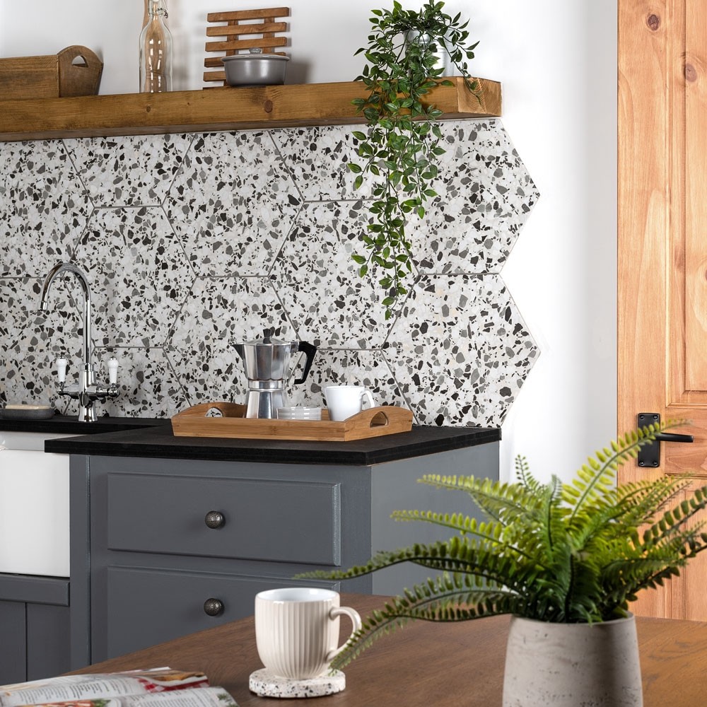 sustainable kitchen with mottled grey hexagon wall tiles from walls and floors