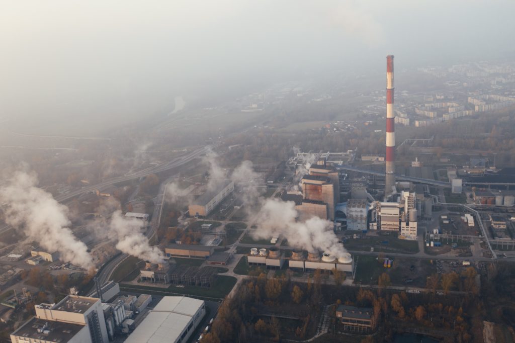 how can carbon offsets help businesses industrial pollution caused by businesses