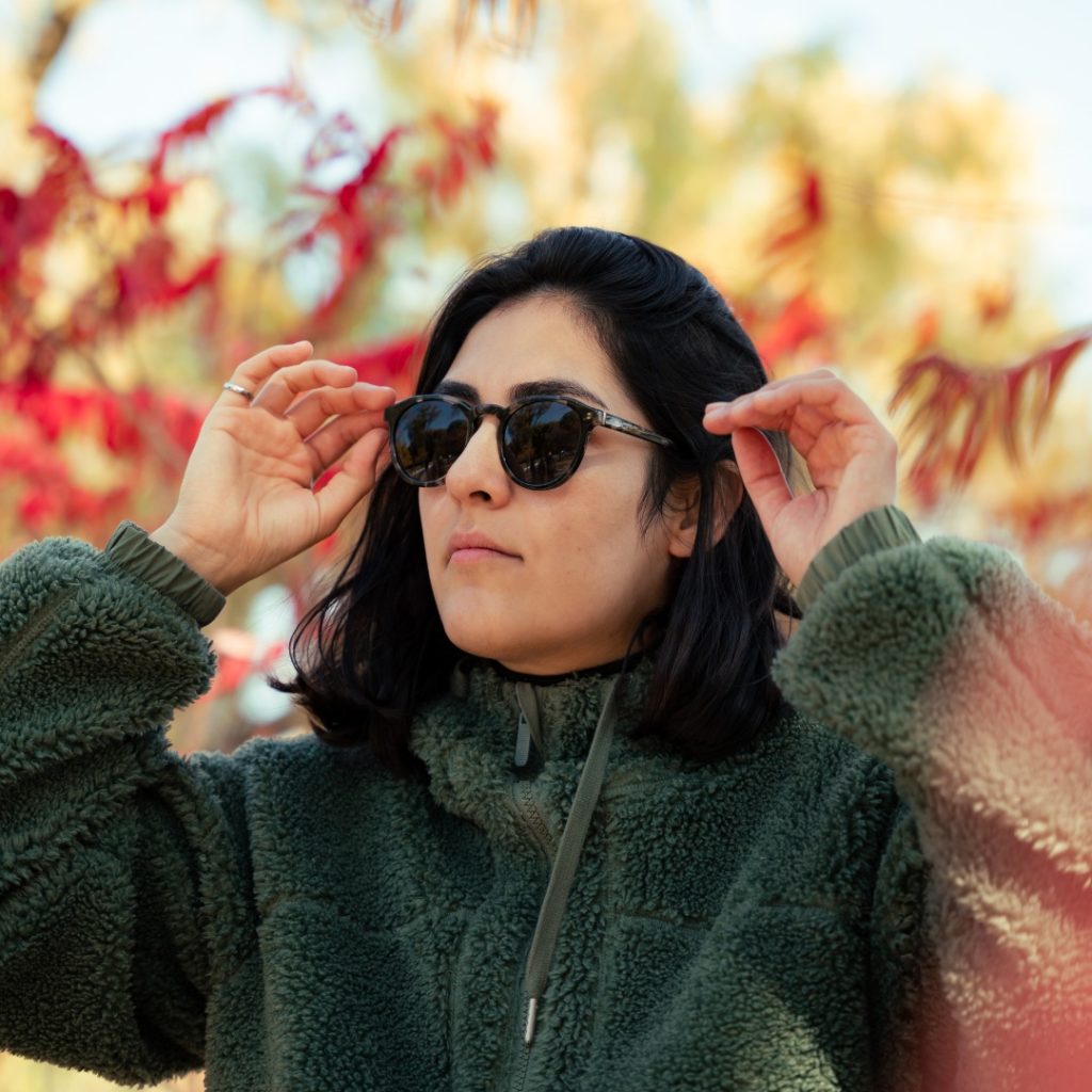 Woman outdoors in fleece wearing Palo Eyewear sunglasses CREDIT Palo Eyewear Facebook Page